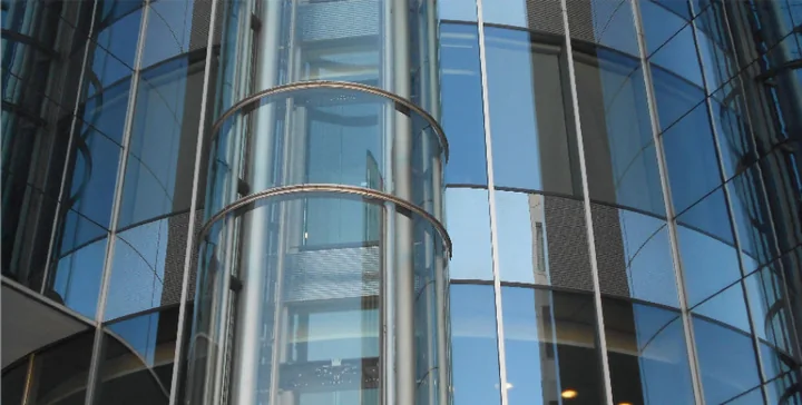 Cylindrical glass panoramic lift exterior